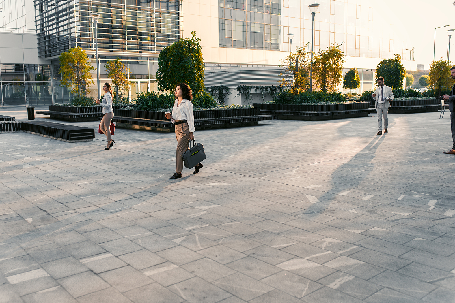 Business woman walking with briefcase after wrongful termination in California